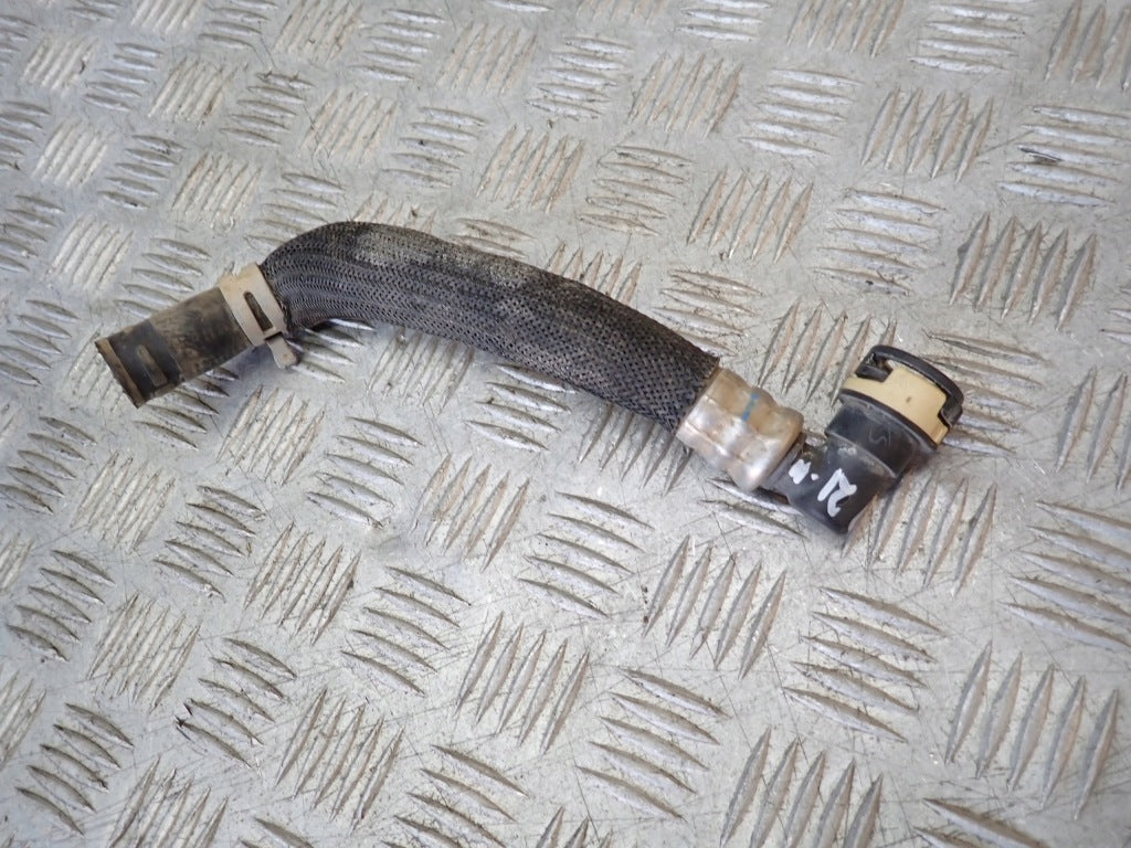 Rura wodna do Ford F150 3.5 2021- od marki Autolandparts, widoczna na zdjęciu, z elastycznym przewodem i końcówkami.