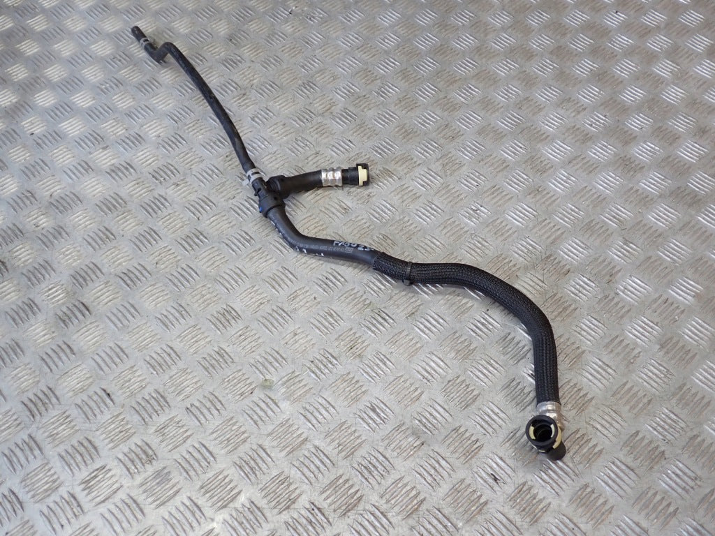 Rura przewód wody do Ford F150 3.5 2021- na zdjęciu, część marki Autolandparts, pokazana na tle silnika.